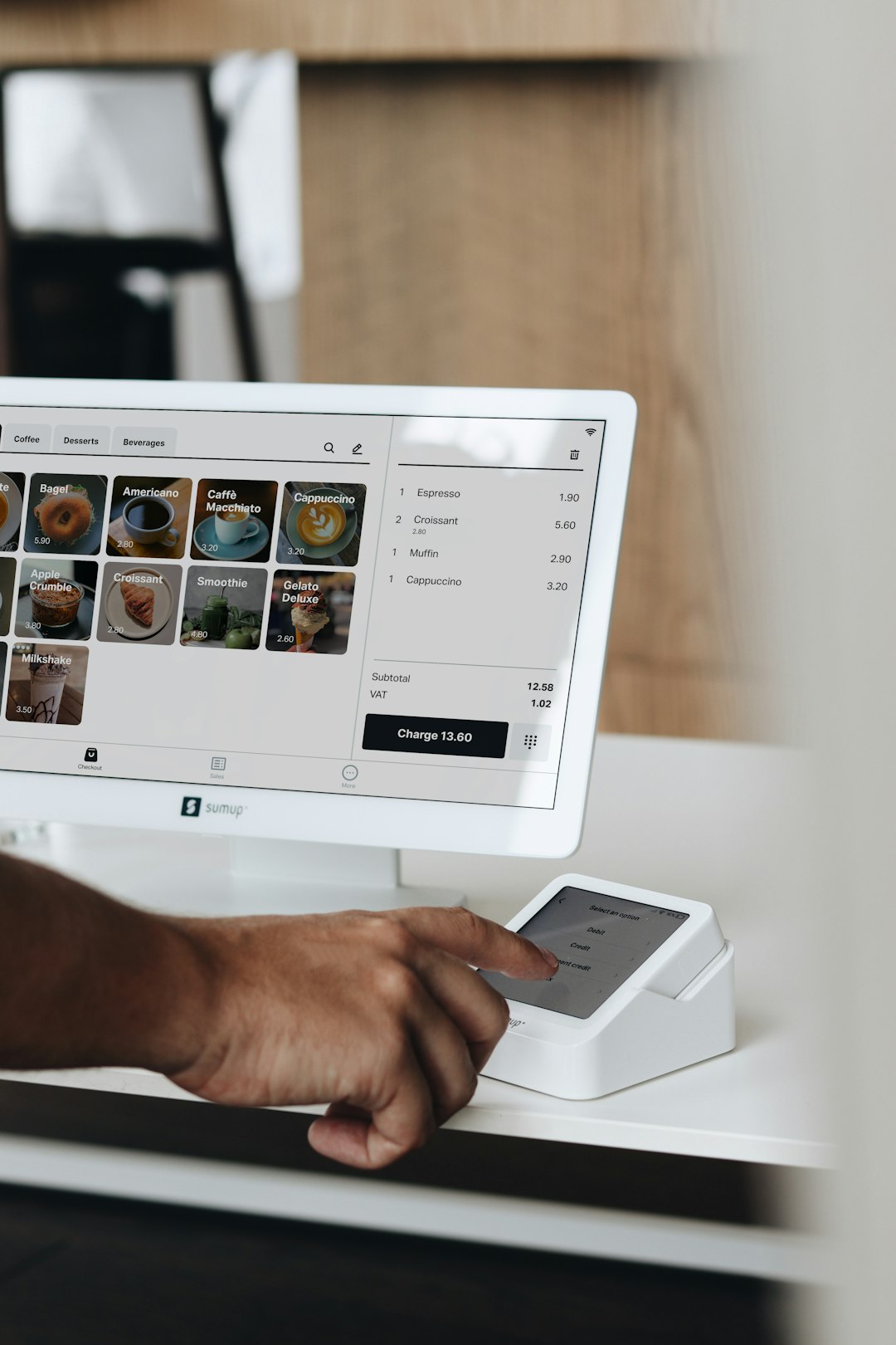A POS system and card reader in a café setting, allowing for easy menu navigation and secure payment processing, perfect for restaurants and small businesses.